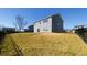 A large backyard with a well-kept lawn and a privacy fence, providing a secure and pleasant outdoor space at 7139 Prelude Rd, Brownsburg, IN 46112