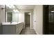 Bathroom featuring a double vanity and tile shower at 7139 Prelude Rd, Brownsburg, IN 46112