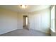 Bedroom with neutral walls, carpeted floor, and closet with doors that provide ample storage at 7139 Prelude Rd, Brownsburg, IN 46112