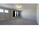 Bedroom with neutral carpet, two windows, and black-out curtains at 7139 Prelude Rd, Brownsburg, IN 46112