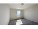 Comfortable bedroom featuring neutral walls, carpeted floors, and a window letting in natural light at 7139 Prelude Rd, Brownsburg, IN 46112