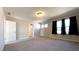 Bedroom with neutral carpet, three windows, and black-out curtains at 7139 Prelude Rd, Brownsburg, IN 46112
