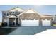 Beautiful two-story home featuring a three-car garage and stone accents at 7139 Prelude Rd, Brownsburg, IN 46112