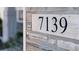 Close-up of the house number '7139' on a stone background at 7139 Prelude Rd, Brownsburg, IN 46112
