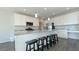 Modern kitchen with stainless steel appliances and a granite island at 7139 Prelude Rd, Brownsburg, IN 46112