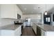 Modern kitchen featuring stainless steel appliances, granite countertops, and white cabinets at 7139 Prelude Rd, Brownsburg, IN 46112