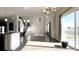 Open-concept living room with staircase, high ceilings, and a view of the water at 7139 Prelude Rd, Brownsburg, IN 46112