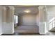 Open living area with neutral walls and large windows at 7139 Prelude Rd, Brownsburg, IN 46112