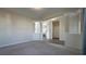 Spacious living area with neutral walls and view of the kitchen at 7139 Prelude Rd, Brownsburg, IN 46112