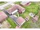 Aerial view of property showing roof, backyard, detached garage, sheds and lawn area at 7808 Crossgate Ln, Southport, IN 46227
