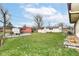 Large backyard with lots of shade, room for a firepit, and shed storage at 7808 Crossgate Ln, Southport, IN 46227