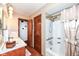 Well-lit bathroom with a bathtub and shower combination at 7808 Crossgate Ln, Southport, IN 46227