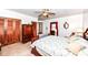 Light-filled bedroom featuring wood furnishings and classic design at 7808 Crossgate Ln, Southport, IN 46227