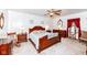 Comfortable bedroom with a large bed and matching wooden furniture set at 7808 Crossgate Ln, Southport, IN 46227