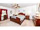 Cozy bedroom with traditional furniture and soft lighting, exuding warmth and style at 7808 Crossgate Ln, Southport, IN 46227