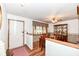 Cozy dining room featuring a ceiling fan and wood flooring at 7808 Crossgate Ln, Southport, IN 46227