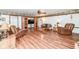 Spacious living room with wood floors, entertainment center, and comfortable furniture at 7808 Crossgate Ln, Southport, IN 46227
