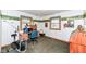 Comfortable office with a desk, computer, office chair, exercise equipment, and custom decoration at 7808 Crossgate Ln, Southport, IN 46227