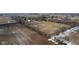 Expansive aerial view of a home with a barn and large fenced-in yard surrounded by agricultural fields at 7968 E 200 S, Whitestown, IN 46075