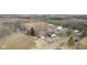 Aerial view of property featuring home, barn, and surrounding land with approximate property lines at 7968 E 200 S, Whitestown, IN 46075