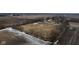 Aerial view of a rural property featuring a house, barn, fenced paddocks, and surrounding farmland at 7968 E 200 S, Whitestown, IN 46075