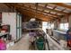 Spacious workshop area featuring exposed beams, ample storage, and natural light at 7968 E 200 S, Whitestown, IN 46075