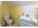 Small bathroom with a modern vanity and a clean, bright yellow wall at 7968 E 200 S, Whitestown, IN 46075