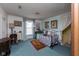 Cozy bedroom with vintage-style furniture and decor, including a daybed and writing desk at 7968 E 200 S, Whitestown, IN 46075