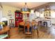 Charming dining area with hardwood floors, unique lighting, and stylish furniture at 7968 E 200 S, Whitestown, IN 46075