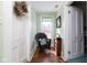 Cozy hallway nook featuring a wicker chair, window, and classic decor at 7968 E 200 S, Whitestown, IN 46075