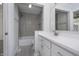 Bright bathroom with a large mirror, white cabinets, and a shower-over-tub combination at 9652 Highgate N Cir, Indianapolis, IN 46250