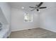 Neutral bedroom with a ceiling fan, window, and soft carpeting for a cozy feel at 9652 Highgate N Cir, Indianapolis, IN 46250