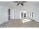 A bright and airy bedroom featuring a ceiling fan and balcony access at 9652 Highgate N Cir, Indianapolis, IN 46250