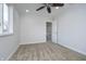 Carpeted bedroom with a ceiling fan, bright window, and a closet off to the side at 9652 Highgate N Cir, Indianapolis, IN 46250