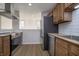 Well-lit kitchen equipped with stainless steel appliances, and a view to the living room at 9652 Highgate N Cir, Indianapolis, IN 46250