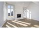 Living area featuring wood floors, a fireplace, and bright windows at 9652 Highgate N Cir, Indianapolis, IN 46250