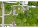 Aerial view of property with house, outbuildings, and lush greenery at 9841 E Raymond St, Indianapolis, IN 46239