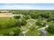 This aerial view shows the tree coverage and the homes in this quiet neighborhood at 9841 E Raymond St, Indianapolis, IN 46239