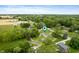 This aerial view shows the tree coverage and the homes in this quiet neighborhood at 9841 E Raymond St, Indianapolis, IN 46239