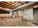 Unfinished basement with concrete floors, exposed beams, and functional utilities at 9841 E Raymond St, Indianapolis, IN 46239