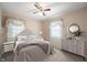 Comfortable bedroom featuring a plush bed, elegant furnishings, and warm, inviting decor at 9841 E Raymond St, Indianapolis, IN 46239