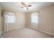 Bright bedroom featuring neutral walls, carpeted flooring, and large windows for natural light at 9841 E Raymond St, Indianapolis, IN 46239