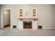 Close-up on fireplace featuring traditional mantle and tile work, enhancing the home's charm at 9841 E Raymond St, Indianapolis, IN 46239