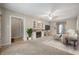 Inviting living room features a fireplace, ceiling fan, and a cozy atmosphere for relaxation and entertainment at 9841 E Raymond St, Indianapolis, IN 46239