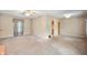 Spacious living room with neutral walls, traditional curtains, and ample natural light, perfect for any decor at 9841 E Raymond St, Indianapolis, IN 46239