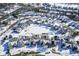 Aerial view showing snow-covered neighborhood with nicely arranged houses, streets and cul-de-sacs during winter at 10953 Mount Vernon N Trl, Indianapolis, IN 46229