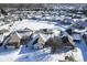 Stunning aerial view of home with beautiful roof, snow covered yard, and surrounding neighborhood in winter at 10953 Mount Vernon N Trl, Indianapolis, IN 46229