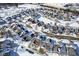 Aerial view of the neighborhood showcasing the beautifully designed layout of houses covered in snow during winter at 10953 Mount Vernon N Trl, Indianapolis, IN 46229