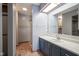 Bathroom vanity area with a sink, mirror, and walk in shower at 10953 Mount Vernon N Trl, Indianapolis, IN 46229