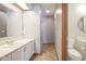 Bright bathroom with updated vanity, sink, toilet and tile flooring at 10953 Mount Vernon N Trl, Indianapolis, IN 46229